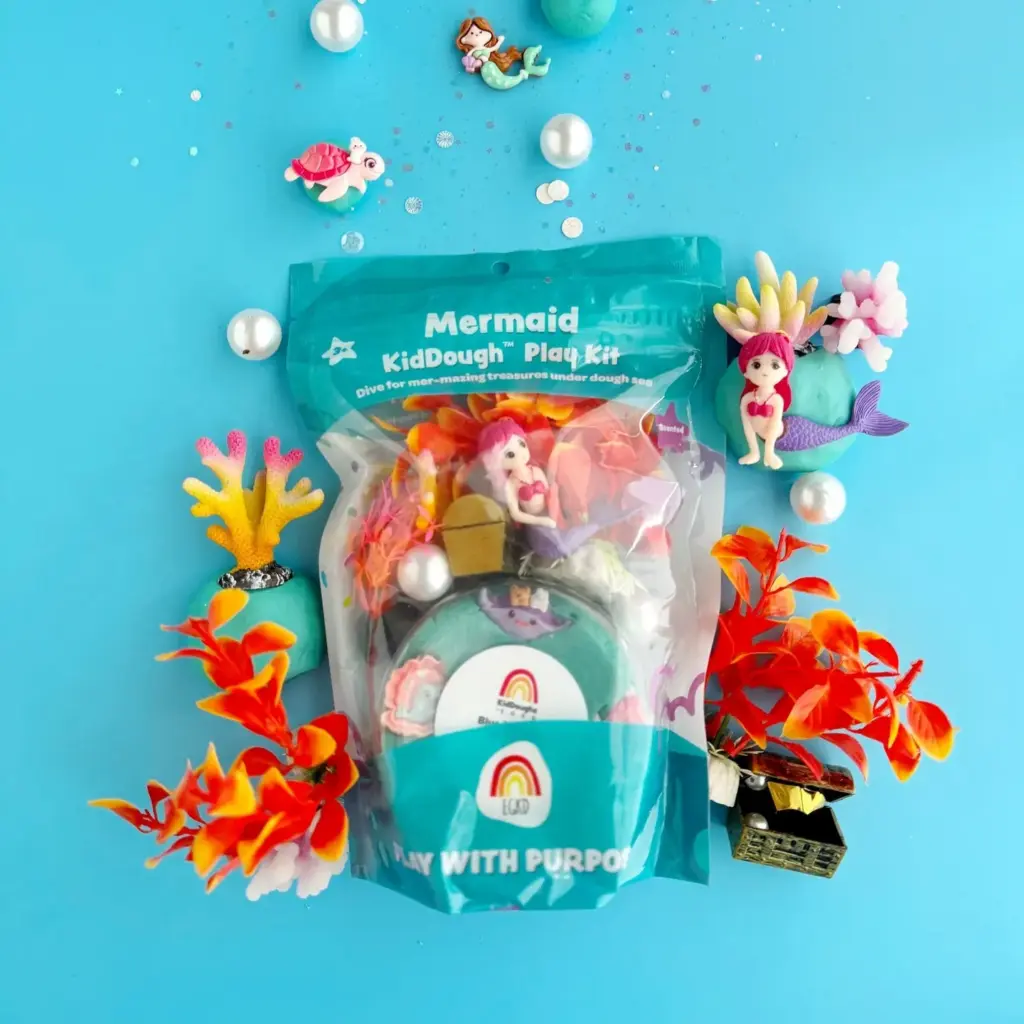Dive into a world of mer-mazing fun with the Mermaid KidDough™ Play Kit! This hands-on kit encourages imaginative play, fine motor skill development, and hours of creative exploration.